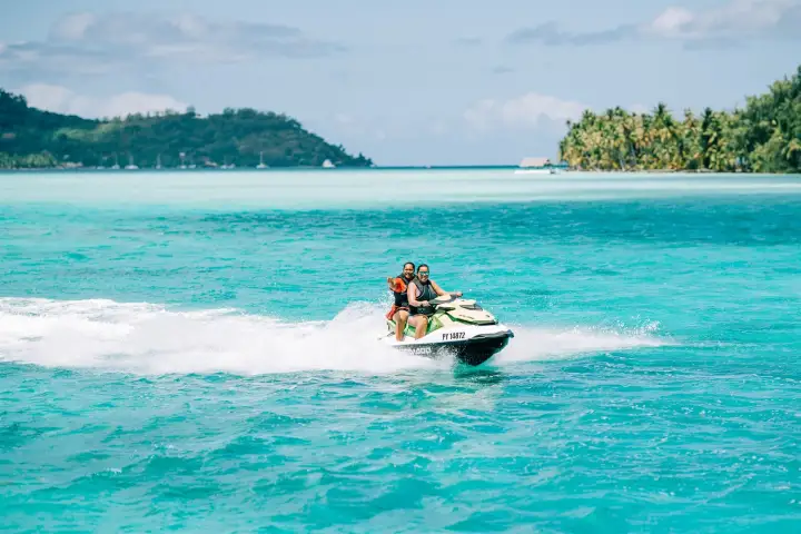 Two women jet skiing in Bora Bora