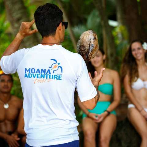 A group of people enjoying coco show in Bora Bora