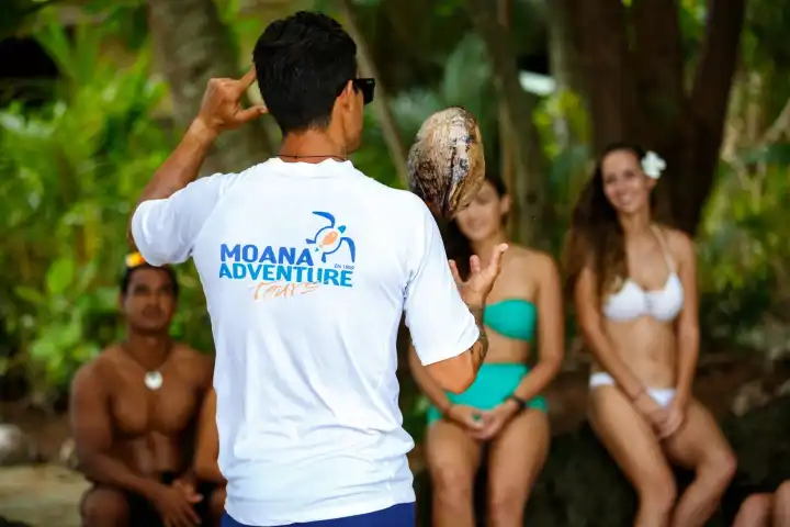 A group of people enjoying coco show in Bora Bora