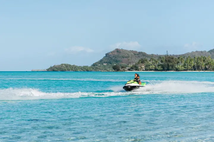 A woman jet skiing in Bora Bora