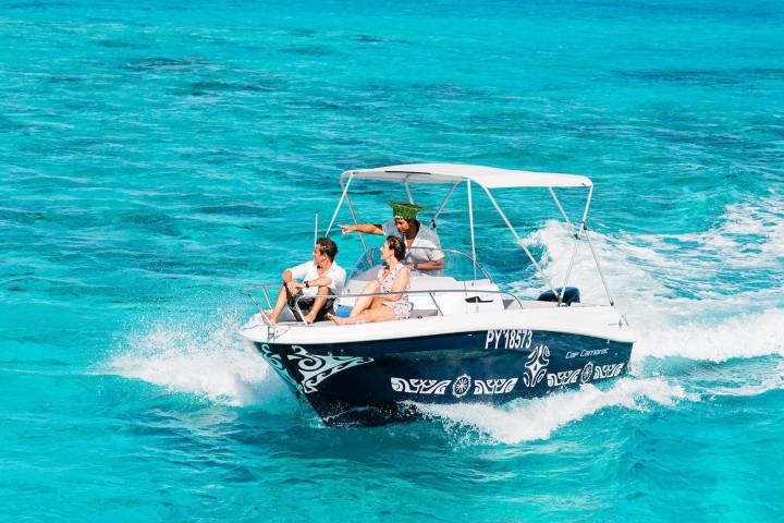 A couple enjoying a private boat tour in Bora Bora