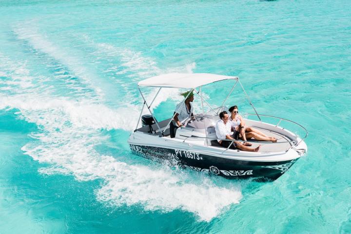 A couple enjoying a private boat tour in Bora Bora