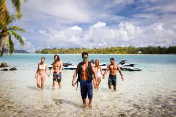 A group of people having a break during a jet ski tour in Bora Bora