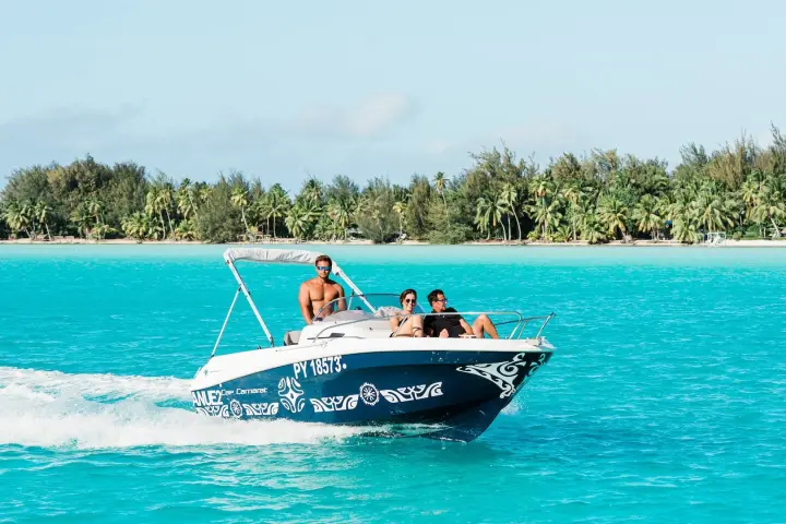 A couple enjoying a private boat tour in Bora Bora