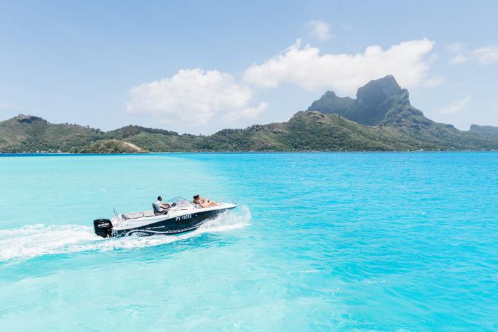 A couple enjoying a private boat tour in Bora Bora