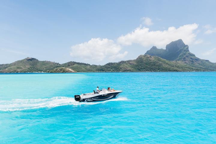 A couple enjoying a private boat tour in Bora Bora