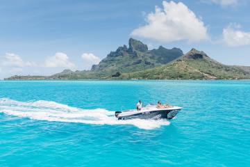 A couple enjoying a private boat tour in Bora Bora