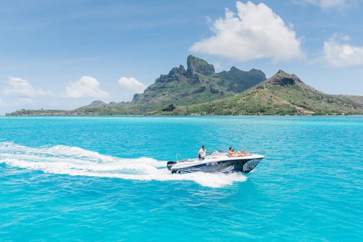 A couple enjoying a private boat tour in Bora Bora