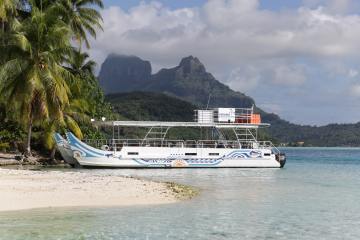 Moana Adventure Tours catamaran waiting for clients