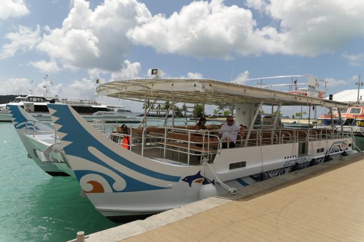 Moana Adventure Tours catamaran at Vaitape pier