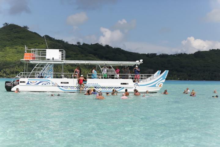 Moana Adventure Tours catamaran waiting for clients