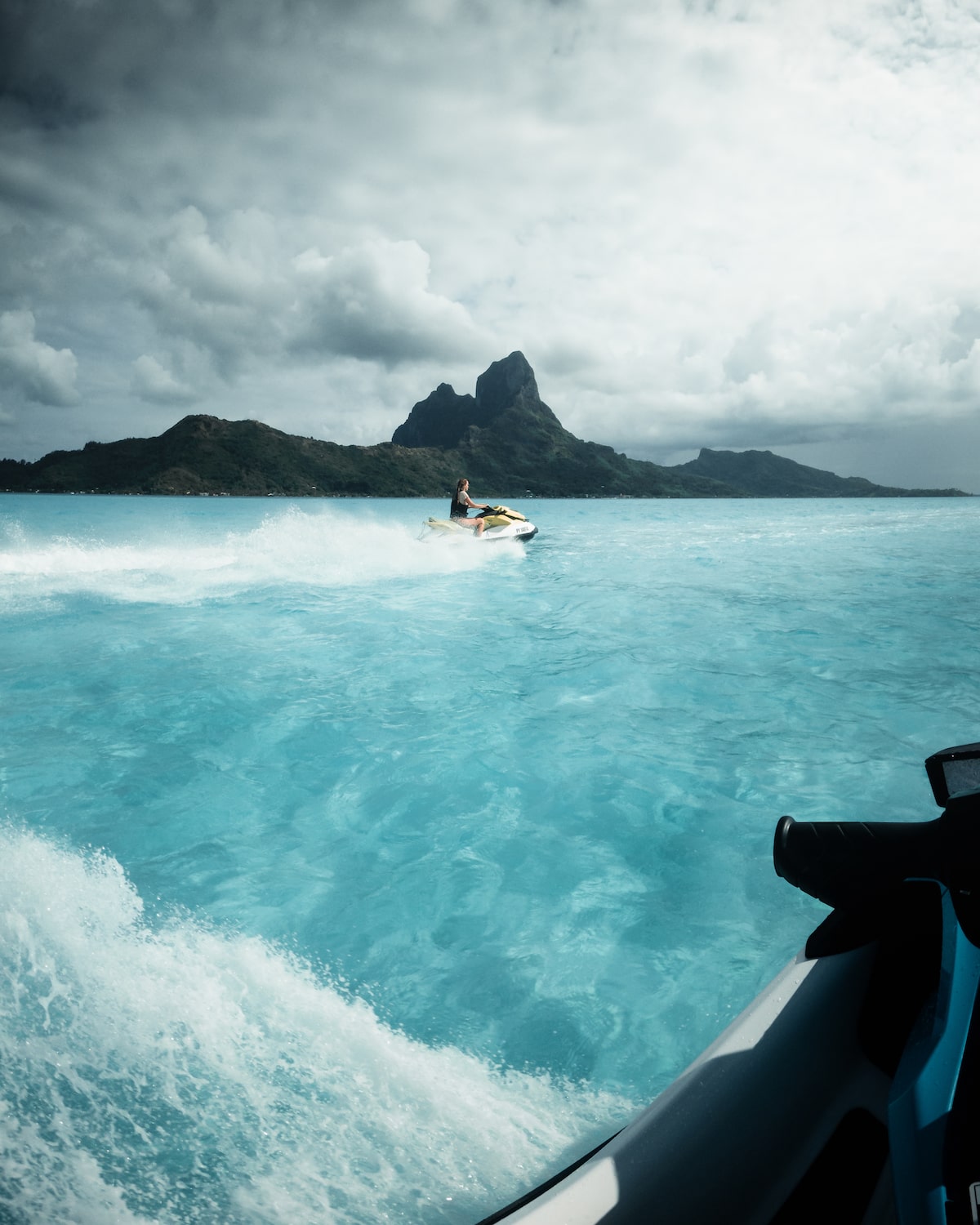 a person riding a wave on top of a body of water