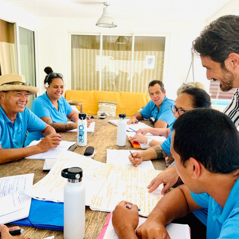 a group of people sitting at a table