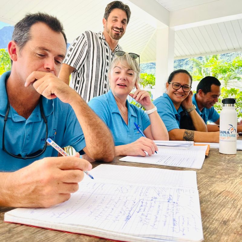 a group of people sitting at a table