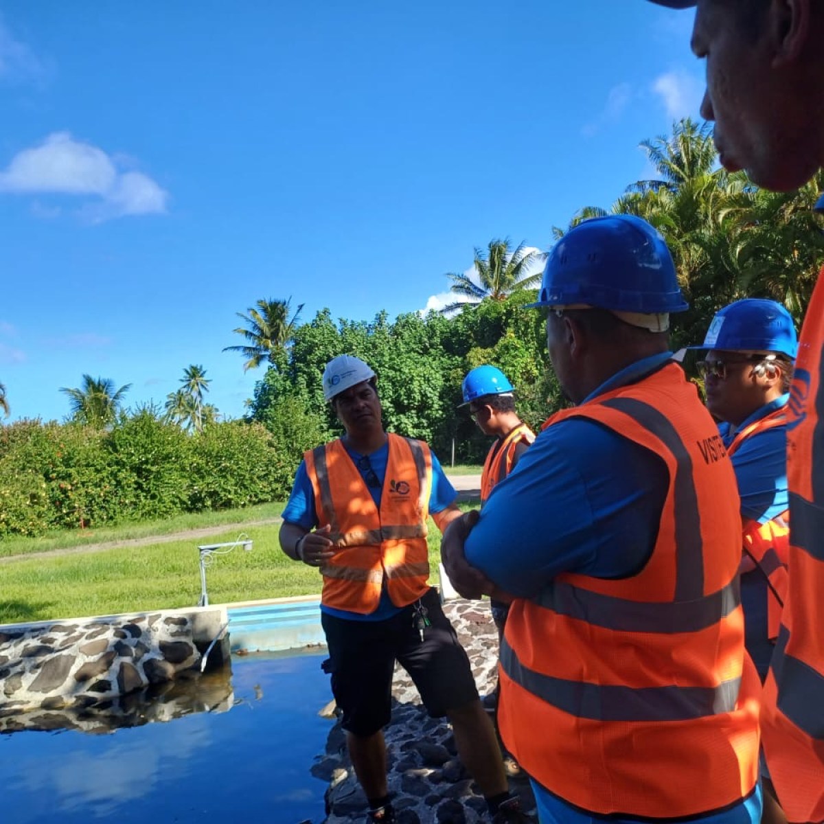 a group of people standing next to a man