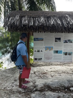 a man standing next to a tree