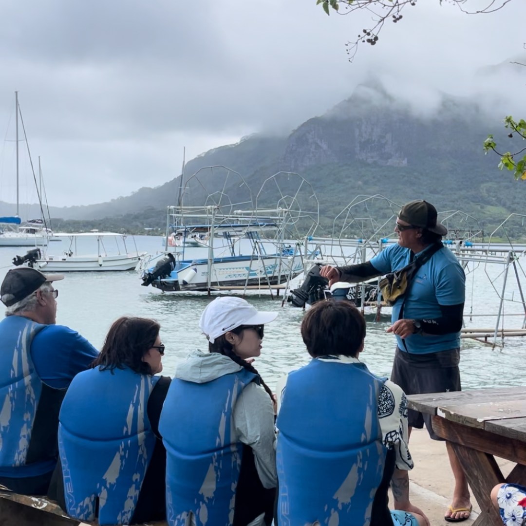 a group of people sitting on a bench